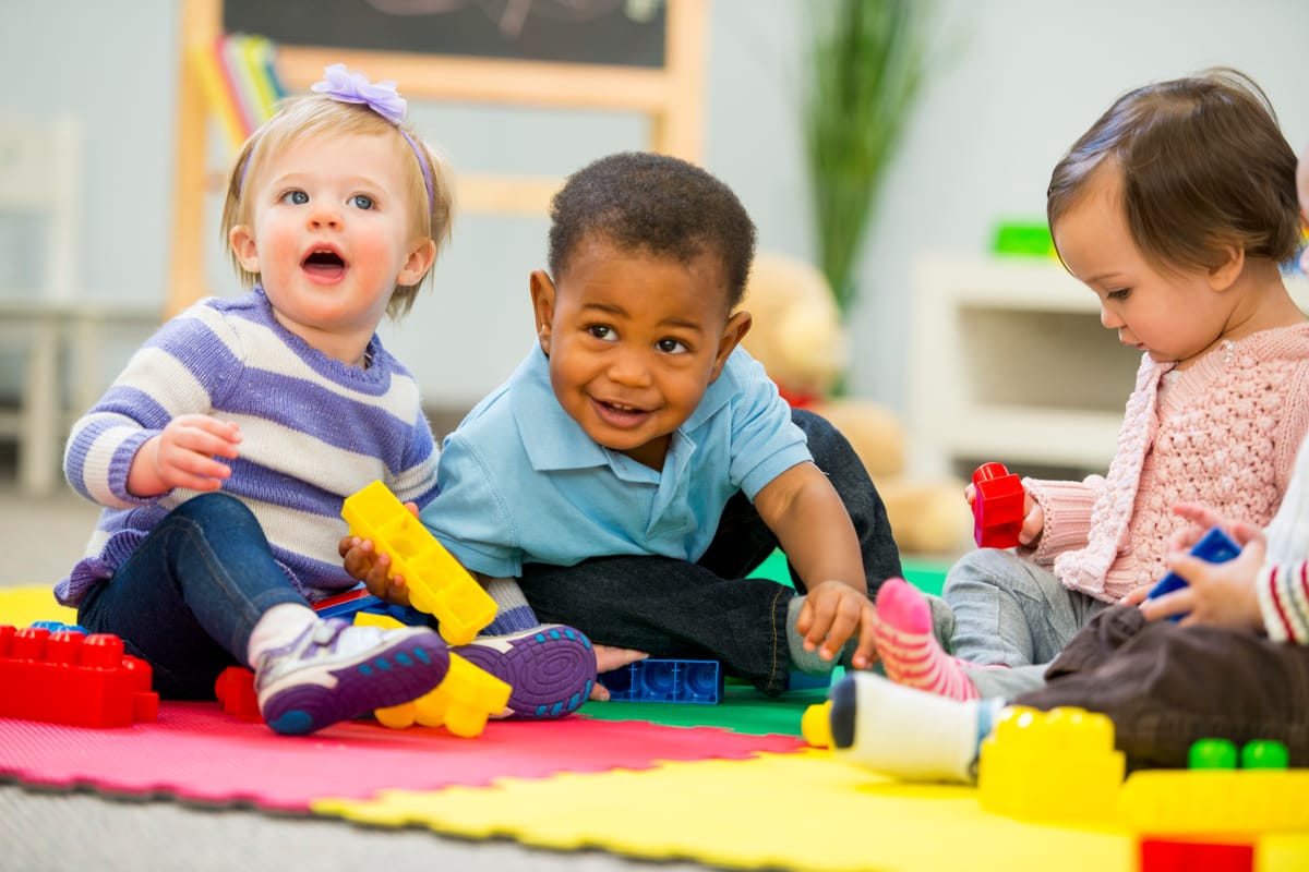Diverse group of babies playing.